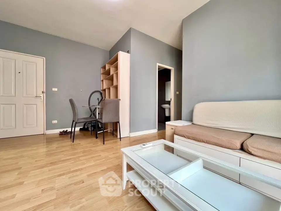 Spacious living room with modern decor and wooden flooring