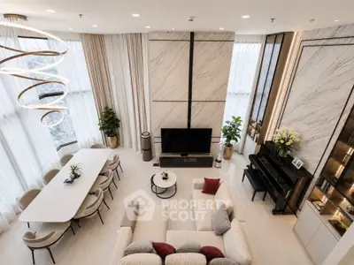 Luxurious high-rise living room with modern decor and panoramic city views.