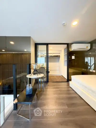 Modern loft bedroom with sleek design and walk-in closet