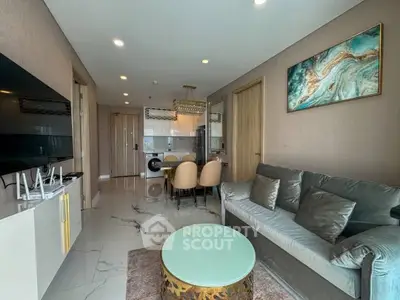 Modern living room with elegant decor and open kitchen layout