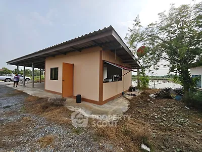 Charming rural property with potential, featuring a simple structure and spacious surroundings.