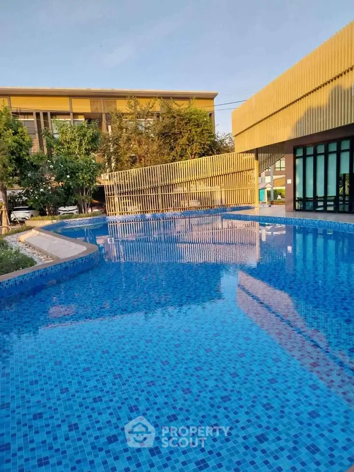 Luxurious residential pool with modern architecture and serene surroundings.