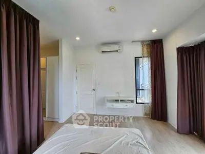 Spacious bedroom with modern design and natural light