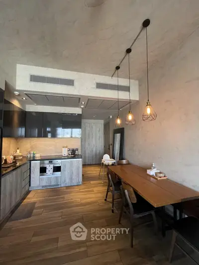 Modern kitchen with open layout and stylish lighting in a contemporary home.