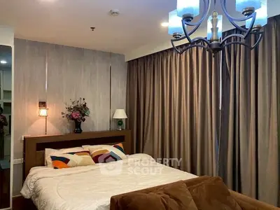 Cozy bedroom with elegant lighting and plush bedding in modern apartment