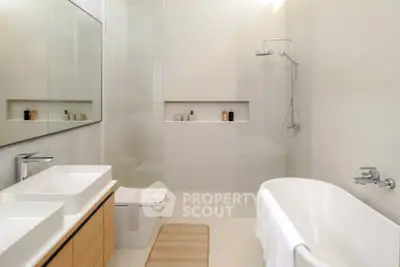 Luxurious modern bathroom with sleek design and elegant fixtures.