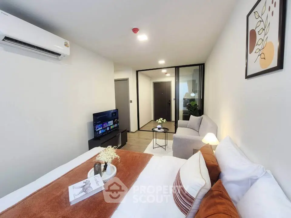 Modern studio apartment with cozy living area and stylish decor