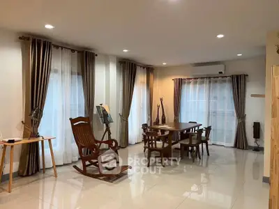 Spacious living room with elegant wooden furniture and large windows