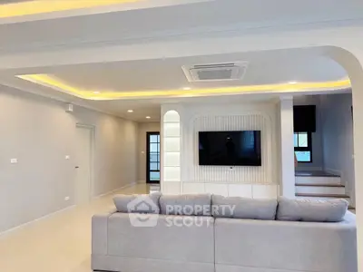 Spacious modern living room with elegant lighting and stylish decor