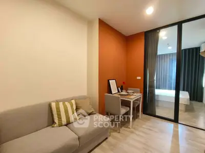 Modern living room with cozy sofa and dining area in stylish apartment