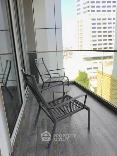 Modern balcony with city view and stylish outdoor seating