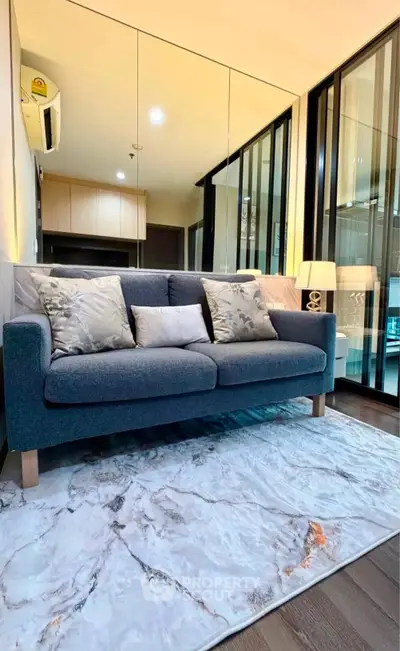 Modern living room with stylish sofa and elegant decor in a cozy apartment setting.