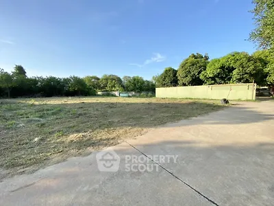Spacious vacant land with lush greenery, perfect for development opportunities.