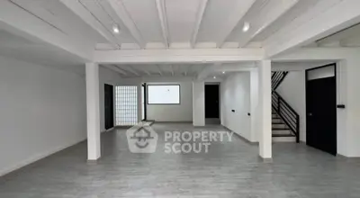 Spacious open-plan interior with modern design and ample natural light.