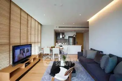 Spacious modern living room with open kitchen and stylish decor