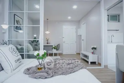 Modern bedroom with stylish decor and cozy ambiance in a contemporary apartment.