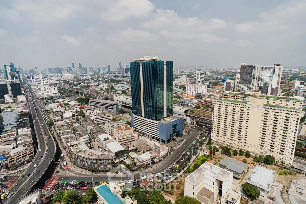 Stunning aerial view of urban skyline with modern skyscrapers and bustling city streets.