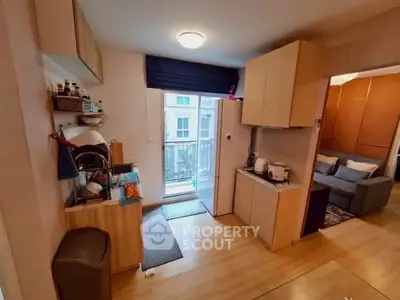 Cozy kitchen with modern appliances and open layout leading to a bright living area.