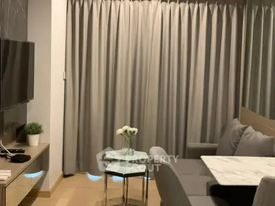 Modern living room with stylish furniture and elegant curtains