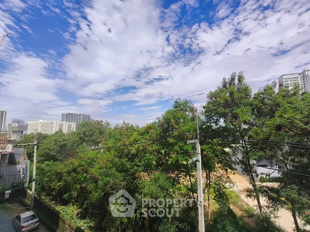 Stunning urban view with lush greenery and clear blue sky