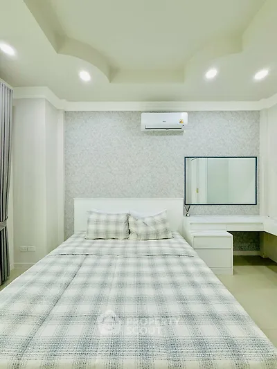 Modern bedroom with stylish decor and air conditioning unit