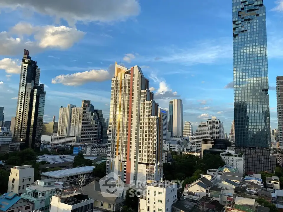 Stunning cityscape view showcasing modern skyscrapers under a clear blue sky, perfect for urban living enthusiasts.