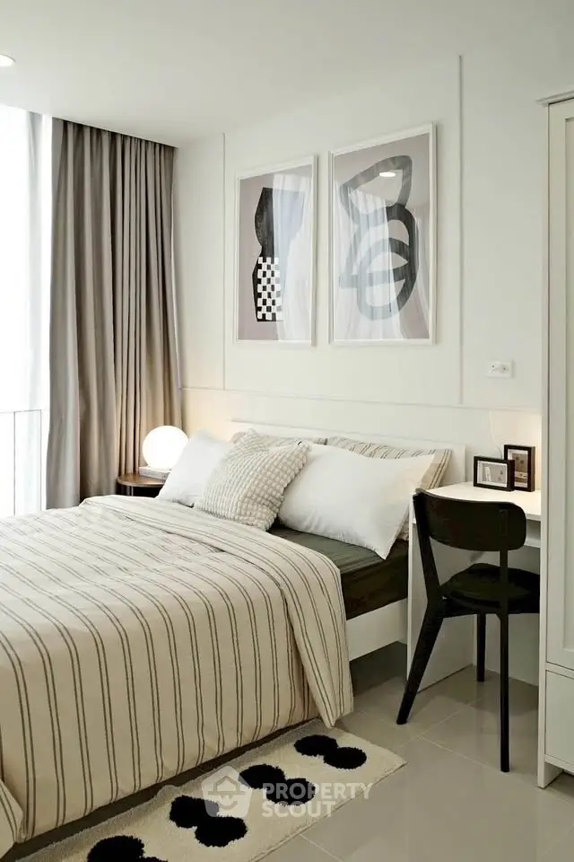 Modern bedroom with stylish decor and natural light