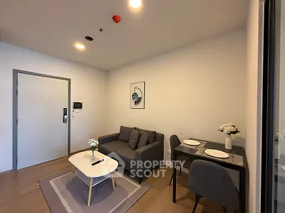 Modern living room with cozy sofa and dining area in stylish apartment