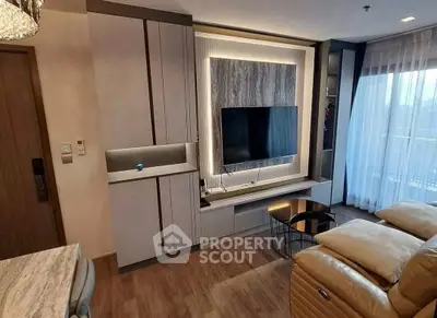 Modern living room with sleek TV setup and cozy seating area