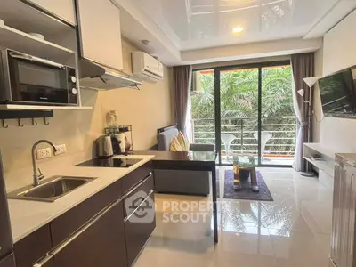 Modern open-layout kitchen and living room with balcony view