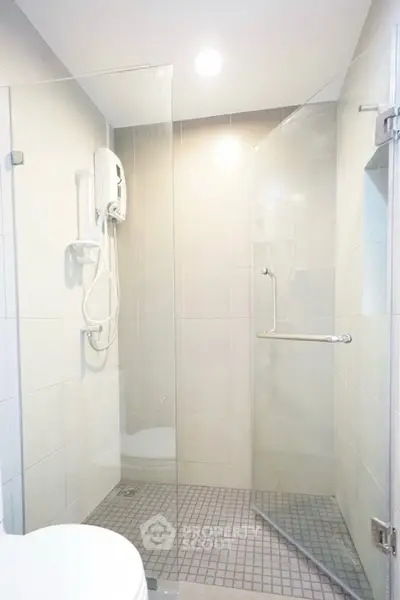 Modern bathroom with glass shower enclosure and sleek design