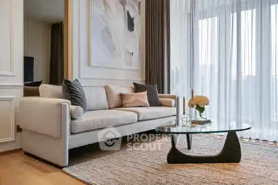 Elegant living room with modern sofa, stylish coffee table, and floor-to-ceiling windows.