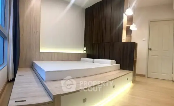 Modern minimalist bedroom with platform bed and ambient lighting