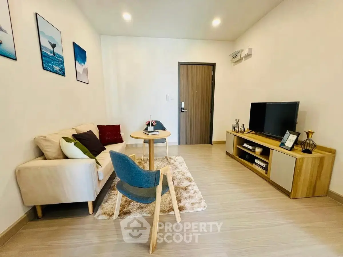 Modern living room with stylish furniture and cozy decor in a contemporary apartment.