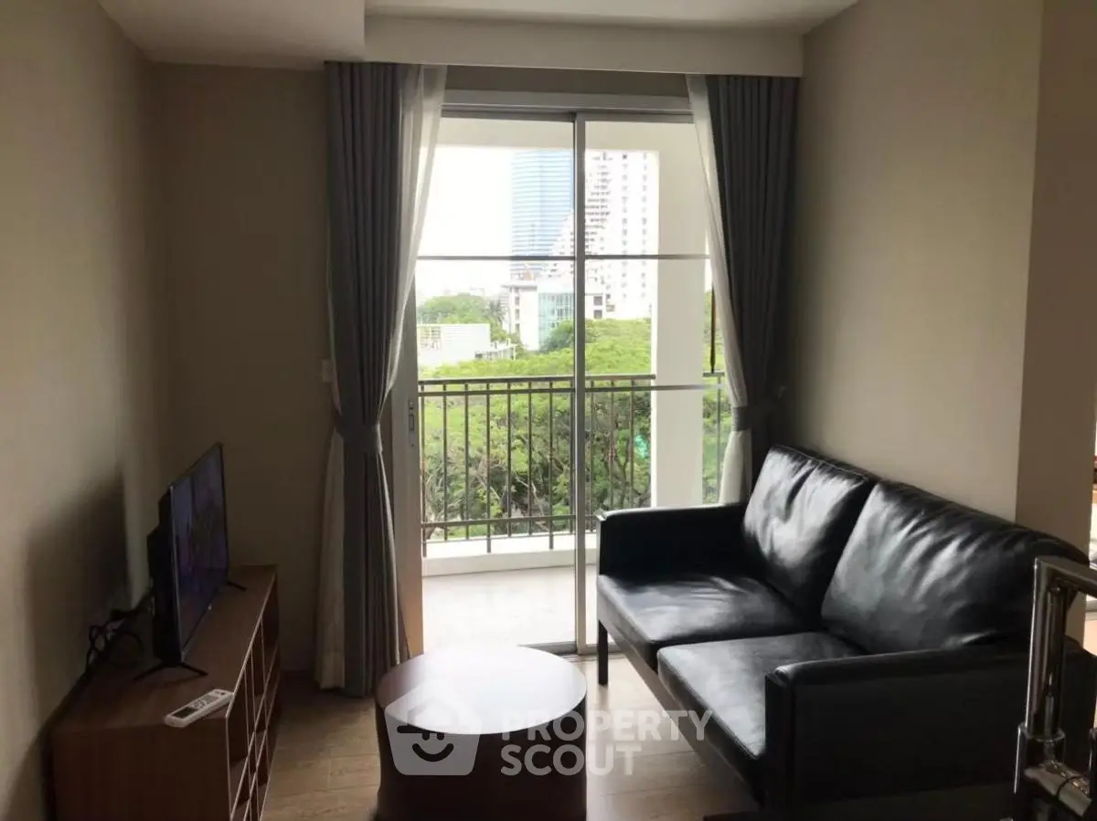 Modern living room with balcony view in urban apartment