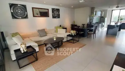 Spacious modern living room with elegant decor and open kitchen layout