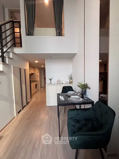 Modern duplex apartment with stylish dining area and open kitchen layout