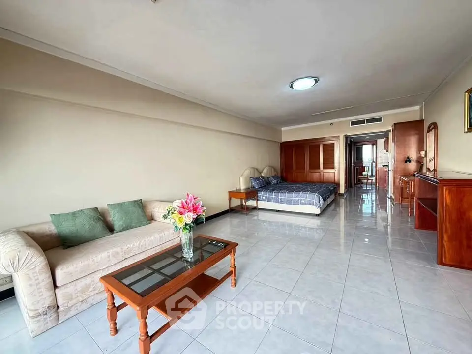 Spacious studio apartment with elegant furnishings and ample natural light.