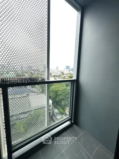 Modern balcony with city view and stylish metal mesh design