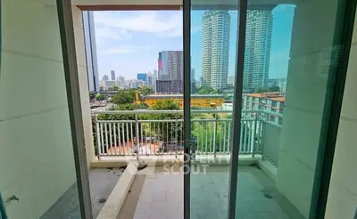 Spacious balcony with city view in modern high-rise apartment