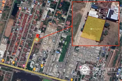 Aerial view of residential area with highlighted property plot for sale.