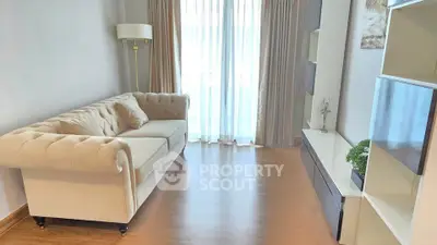 Elegant living room with plush sofa and natural light