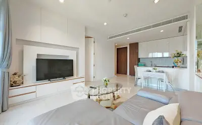 Modern living room with sleek design and open kitchen layout