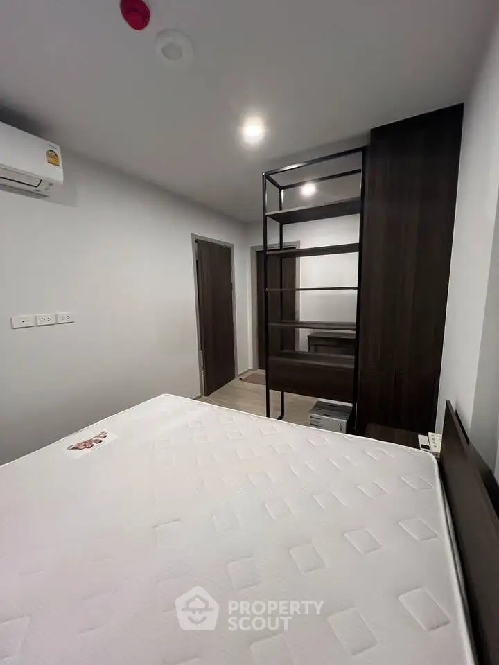 Modern bedroom with sleek design and ample storage space