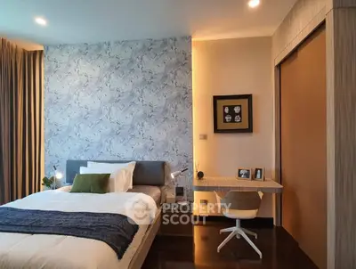 Modern bedroom with stylish decor and cozy workspace