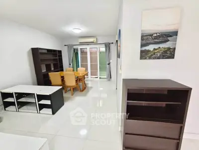 Spacious living room with modern furniture and large windows for natural light.