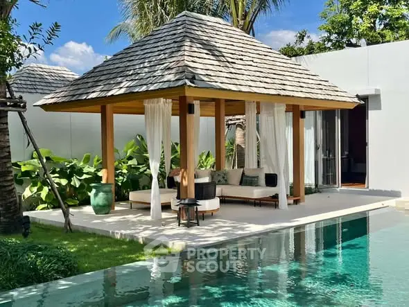 Luxurious poolside pavilion with lush greenery and serene ambiance, perfect for relaxation and outdoor enjoyment.
