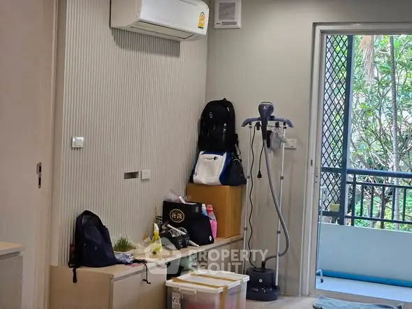 Modern apartment interior with balcony access and air conditioning