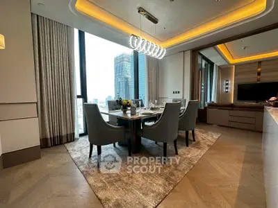 Luxurious dining area with modern lighting and city view in upscale apartment