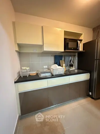 Modern kitchen with sleek cabinets and stainless steel appliances